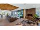 Spacious living area featuring a brick fireplace, large windows, and comfortable seating at 221 E 14Th St, Tempe, AZ 85281