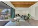 Bright living room with hardwood floors, modern furniture, and sliding glass doors leading to the backyard at 221 E 14Th St, Tempe, AZ 85281