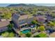 Aerial view of house with pool and mountain backdrop at 27486 N 89Th Dr, Peoria, AZ 85383