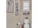 Small bathroom with toilet and shelf at 27486 N 89Th Dr, Peoria, AZ 85383