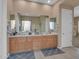 Bathroom with double vanity and large mirror at 27486 N 89Th Dr, Peoria, AZ 85383