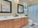Double vanity bathroom with large mirrors at 27486 N 89Th Dr, Peoria, AZ 85383