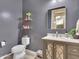 Modern powder room with gray walls and a stylish vanity at 27486 N 89Th Dr, Peoria, AZ 85383