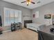 Bedroom with built-in desk and window seat at 27486 N 89Th Dr, Peoria, AZ 85383