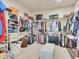 Large walk-in closet with ample shelving and drawers at 27486 N 89Th Dr, Peoria, AZ 85383