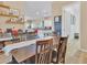Casual dining area with a table and chairs, adjacent to the kitchen at 27486 N 89Th Dr, Peoria, AZ 85383