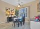 Formal dining room with a chandelier and plenty of natural light at 27486 N 89Th Dr, Peoria, AZ 85383
