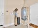 Garage with water softener and water heater at 27486 N 89Th Dr, Peoria, AZ 85383