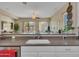 Bright kitchen with white cabinets, granite countertops, and stainless steel appliances at 27486 N 89Th Dr, Peoria, AZ 85383