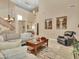 Open living room with high ceilings and neutral color palette at 27486 N 89Th Dr, Peoria, AZ 85383