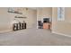 Home office with built-in shelving, a desk, and plenty of natural light at 27486 N 89Th Dr, Peoria, AZ 85383