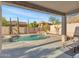 Inviting backyard oasis with a sparkling pool and waterfall feature at 27486 N 89Th Dr, Peoria, AZ 85383