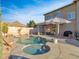 Luxury backyard with a large pool, spa, and patio furniture at 27486 N 89Th Dr, Peoria, AZ 85383