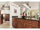 Modern kitchen with dark wood cabinets and granite countertops at 29806 N 43Rd Pl, Cave Creek, AZ 85331