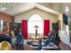 Living room with hardwood floors, a large window, and red curtains at 29806 N 43Rd Pl, Cave Creek, AZ 85331