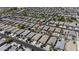 An aerial view highlights the layout of the neighborhood with many uniform, well-maintained homes at 40015 W Crane Dr, Maricopa, AZ 85138