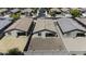 An aerial view of a backyard featuring a gravel area, block wall, and exterior of the home at 40015 W Crane Dr, Maricopa, AZ 85138