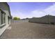 Sizeable backyard featuring gravel, offering versatile space for various outdoor possibilities at 40015 W Crane Dr, Maricopa, AZ 85138