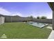 Large backyard featuring a pool, spa and greenery, perfect for outdoor enjoyment at 40015 W Crane Dr, Maricopa, AZ 85138