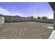 Large backyard with gravel landscaping, offering a blank canvas for outdoor living and entertaining at 40015 W Crane Dr, Maricopa, AZ 85138