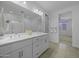 Large primary bathroom with double sink vanity, shower, and an open view into the bedroom at 40015 W Crane Dr, Maricopa, AZ 85138