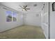 Bright bedroom with a barn door entrance to another room and natural light from windows at 40015 W Crane Dr, Maricopa, AZ 85138