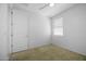 Bright bedroom with window and a door leading to another area in the home at 40015 W Crane Dr, Maricopa, AZ 85138