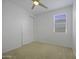 Bright bedroom with a ceiling fan, closet and natural light from the window at 40015 W Crane Dr, Maricopa, AZ 85138