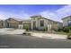Attractive single-story home featuring desert landscaping, a two-car garage, and a cozy front entrance at 40015 W Crane Dr, Maricopa, AZ 85138