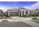 Charming single-story home featuring desert landscaping, a two-car garage, and a welcoming front porch at 40015 W Crane Dr, Maricopa, AZ 85138
