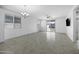 Bright living room features tiled flooring, neutral walls, and natural light at 40015 W Crane Dr, Maricopa, AZ 85138