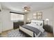 Traditional bedroom featuring a neutral color palette, carpet flooring, and a ceiling fan with a dark-wood dresser at 5525 E Thomas Rd # N1, Phoenix, AZ 85018