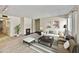 Open-concept living room boasts a fireplace, neutral decor, and an abundance of natural light from a nearby window at 5525 E Thomas Rd # N1, Phoenix, AZ 85018