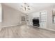 Spacious living room featuring hardwood floors and a fireplace at 7953 S Dateland Dr, Tempe, AZ 85284