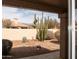 Views from the home showcase the drought resistant landscaping with native succulents and trees and mountain backdrop at 8598 E Saguaro Blossom Rd, Gold Canyon, AZ 85118