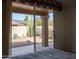Enjoy the desert landscape from the sliding glass doors in the bedroom, with a view of cacti and rock features at 8598 E Saguaro Blossom Rd, Gold Canyon, AZ 85118
