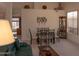 Inviting dining area with a glass table, seating for six, and seamless transition to the living space at 8598 E Saguaro Blossom Rd, Gold Canyon, AZ 85118