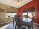 Bright dining area with a wood table and chairs, near a kitchen at 9562 W Carol Ave, Peoria, AZ 85345