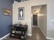 Home hallway with dark wood flooring and decorative accents at 9562 W Carol Ave, Peoria, AZ 85345