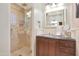 Bathroom features a walk-in shower and a modern vanity with granite countertops at 1535 E Calavar Dr, Phoenix, AZ 85022