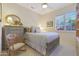 Charming bedroom with rocking chair and built-in shelving at 1535 E Calavar Dr, Phoenix, AZ 85022