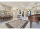 Elegant dining room featuring a large chandelier, hardwood floors, and a formal dining table at 1535 E Calavar Dr, Phoenix, AZ 85022