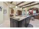 Spacious kitchen with large granite island and breakfast bar at 1535 E Calavar Dr, Phoenix, AZ 85022