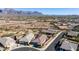 Aerial view of houses and neighborhood with mountain views at 1744 E 16Th Ave, Apache Junction, AZ 85119