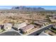 Aerial view of houses and neighborhood with mountain views at 1744 E 16Th Ave, Apache Junction, AZ 85119