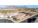 Aerial view of a house with desert landscape and mountain views at 1744 E 16Th Ave, Apache Junction, AZ 85119