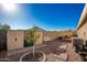 Backyard with storage sheds, small tree, and garden at 1744 E 16Th Ave, Apache Junction, AZ 85119