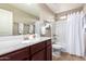 Bathroom with tub, single vanity, and linen storage at 1744 E 16Th Ave, Apache Junction, AZ 85119