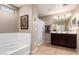 Elegant bathroom with a bathtub, double vanity, and shower at 1744 E 16Th Ave, Apache Junction, AZ 85119