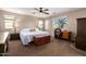 Bright bedroom with a queen-size bed and built-in workspace at 1744 E 16Th Ave, Apache Junction, AZ 85119